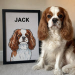 Cavalier King Charles Spaniel sitting beside a framed custom watercolor pet portrait personalized with the name Jack.